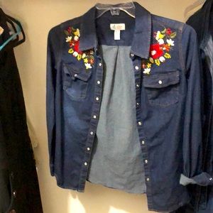 I am selling this chic jean shirt. It’s an XS.